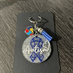 Hand crafted Autism puzzle ribbon with charm and color tassel keychain